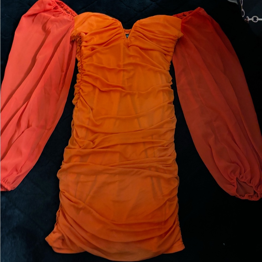 Orange mini dress with chiffon sleeves. Brand new. Never worn.